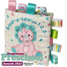 Load image into Gallery viewer, Soft Book, Aroarasaurus by Mary Meyer is a dinosaur-themed baby book with colorful Taggies ribbons, perfect for bedtime stories.
