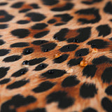 Close-up of water droplets on Roamio by Bumkins Wet/Dry Clutch: Leopard.