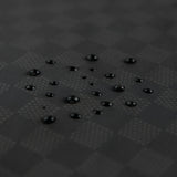 Close-up of water droplets on Roamio by Bumkins Wet/Dry Bag: Rich Black.