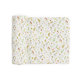 Little Unicorn Organic Cotton Muslin Swaddle—Floral Field: white with colorful wildflowers & green leaves, partially rolled.
