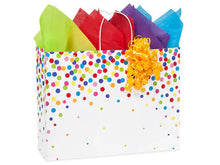 Load image into Gallery viewer, The Zoolikins gift wrapping is a white bag with colorful dots, vibrant tissue paper, and a yellow curly ribbon. Perfect for any occasion!.