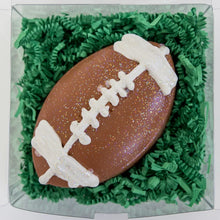 Load image into Gallery viewer, Hopscotchs football-shaped sidewalk chalk has fun sparkles, white laces, and comes in a bright box on green shredded paper.