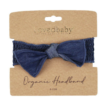 Denim Smocked Headband: dark navy blue headband on tan cardboard packaging card; Lovedbaby logo with text "Organic Headband 0-12 M"