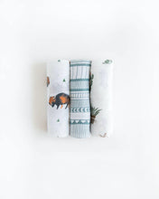 Load image into Gallery viewer, Little Unicorns Cotton Swaddle Set includes three blankets with bison, geometric patterns, and turtle prints on a white background.