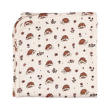 Organic Blanket, Tiny Tortoise: cream blanket with tortoise and flower pattern.