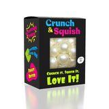 Showcase Crunch & Squish: black box with clear window shows pearly fidget toy inside. For ages 3+.