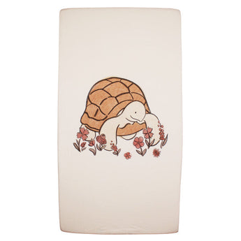 Organic Crib Sheets, Tiny Tortoise: 100% organic beige cotton sheets with a tortoise and flower illustration.