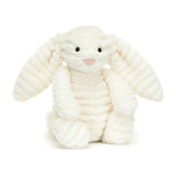 Jellycat Bashful Bunny Luxe Nimbus, a plush lop-eared bunny, sits upright with stitched nose and button eyes against a plain background.