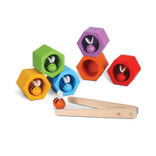 Load image into Gallery viewer, PlanToys Beehives features colorful hexagonal blocks, bees, and tweezers to boost fine motor skills and color recognition.