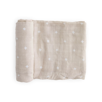 Little Unicorn Cotton Swaddle, Taupe Cross: breathable taupe muslin blanket with white crosses, neatly folded on a white background.