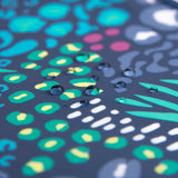 Close-up of water droplets on Bumkins Short-Sleeved Smock: Animal Prints.