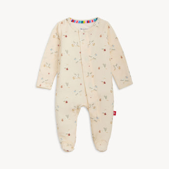 Magnetic Me Footie Special Delivery: cream modal sleeper with long sleeves, bear/tree prints & magnetic closures, laid flat on white.