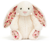 Jellycat Blossom Bunny Berry—this plush bunny has pink floral ears and feet, sitting upright against a white backdrop.