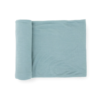 Little Unicorn Stretch Knit Swaddle Blanket - Harbor, light blue, partially unrolled on a white background.