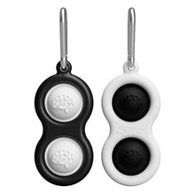 Load image into Gallery viewer, The Simpl Dimpl by Fat Brain Toy Co features two black and white double-sided key tags with brain logos, each on a metal ring.