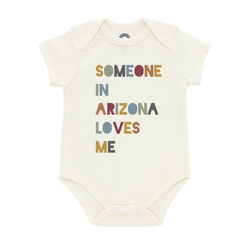 Emerson and Friends Luxury Bodysuit, featuring Someone in Arizona loves me, is machine washable and crafted from premium beige cotton.