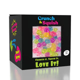Showcase Crunch & Squish Candy: a black box with colorful beads, sensory toy series for ages 3+, labeled "Love It!.