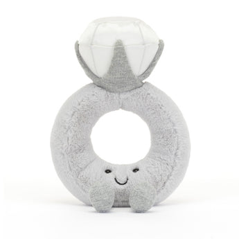 Jellycat Amuseable Diamond Ring is a plush toy shaped like a smiling diamond ring, featuring soft silver fur and charm.