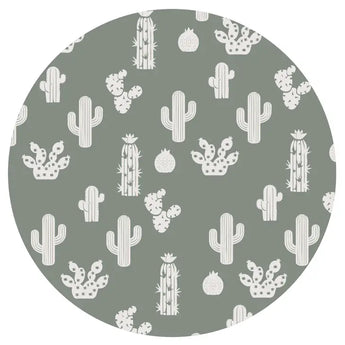 The Sleeper, Stay Sharp by Emerson and Friends features a muted green background with white cacti, reminiscent of bamboo baby pajamas.