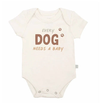 Organic Bodysuit, Every Dog Needs a Baby: white short sleeve bodysuit with text "Every Dog Needs A Baby." Made of 100% organic cotton.