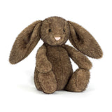Jellycat Hoppleston Luxe Bunny is a plush brown bunny toy with long floppy ears, sitting upright on a white background.