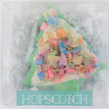 Load image into Gallery viewer, Festive Sidewalk Chalk in a Christmas tree shape with bright colors and sprinkles, packaged by Hopscotch.