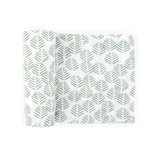 Little Unicorn Cotton Muslin Swaddle Blanket in Leaf Motif, partially rolled, shown on a plain light background.