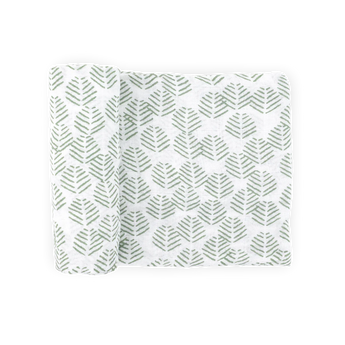 Little Unicorn Cotton Muslin Swaddle Blanket in Leaf Motif, partially rolled, shown on a plain light background.