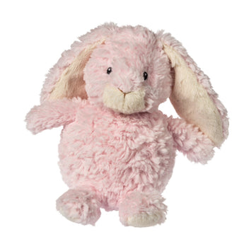 Mary Meyer’s Candy Sprouts Bunny is a fluffy pink plush toy with long floppy ears and black eyes, facing forward.