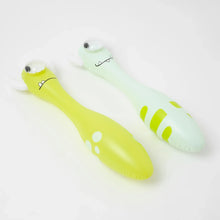 Load image into Gallery viewer, Two Sunnylife inflatable toys: Monty the Monster (lime green with spots) and a striped light green one, both on white.
