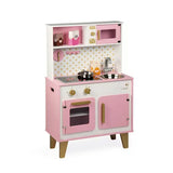 Janod Juratoys Candy Chic Big Cooker: a pink and white wooden play kitchen with a stove, sink, oven, microwave, and play food accessories.
