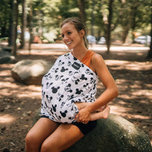 Load image into Gallery viewer, A woman smiles outdoors with her baby in a Milk Snob Cover Disneys Mickey Sketch, perfect as a multifunctional car seat cover.