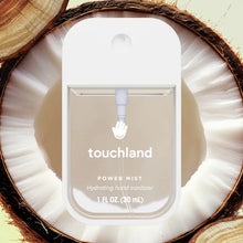 Load image into Gallery viewer, Hydrating Hand Sanitizer: clear sanitizer bottle with white cap & text "touchland Power Mist Hydrating hand sanitizer" on a coconut half.