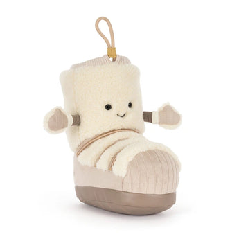 Jellycat Perta Snow Boot plush in cream with a smiling face, small arms, and a hanging loop.