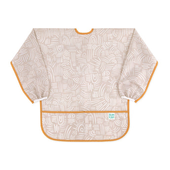 Bumkins Long-Sleeved Art Smock: Wander—beige waterproof fabric with white abstract design, orange trim, front pocket, and adjustable tie closure.