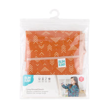 Load image into Gallery viewer, Bumkins Long-Sleeved Art Smock: Grounded is shown folded in plastic packaging bag with a hanger and cardboard insert.