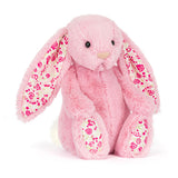 Jellycat Blushkin Blossom Luxe Bunny, a pink plush with long floral-lined ears, sits facing forward on a white background.