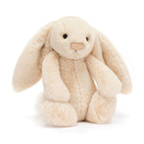 Jellycat Bashful Luxe Willow Bunny in soft beige sits upright, floppy-eared, facing forward on a white background.