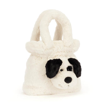 Jellycat, Handbag Rufferty Puppy, a cream-colored plush handbag shaped like a puppy face with black ears and a black eye patch.