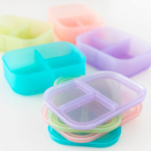 Load image into Gallery viewer, Bumkins Silicone Bento Box 3 Section: Purple Jelly sits among other similar bento boxes on a white background, their lids stacked.