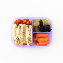Load image into Gallery viewer, Bumkins Silicone Bento Box 3 Section: Purple Jelly holds a sandwich, grapes, blackberries, carrots, and cherry tomatoes on a white background.