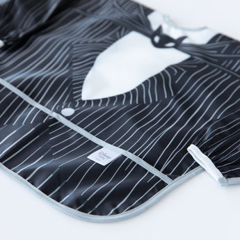 Close-up of Bumkins Sleeved Bib: Jack Skellington on a white background, showcasing the outer pocket.