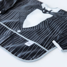Load image into Gallery viewer, Close-up of Bumkins Sleeved Bib: Jack Skellington on a white background, showcasing the outer pocket.