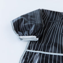 Load image into Gallery viewer, Close-up of Bumkins Sleeved Bib: Jack Skellington on a white background, with focus on the white elastic cuff on the sleeve.