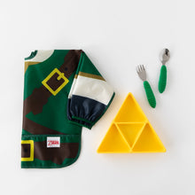 Load image into Gallery viewer, Bumkins Spoon + Fork: Jade sits near a yellow triangle-shaped plate and a folded green tunic-style bib on a white background.