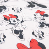 Close-up of water droplets on Bumkins Sleeved Bib: Minnie Mouse.