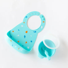 Load image into Gallery viewer, Bumkins Silicone First Feeding Set: Blue sits near a blue silicone bib on a white background.