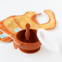 Load image into Gallery viewer, Bumkins Silicone First Feeding Set: Clay sits on a white background in front of two colorful bibs.