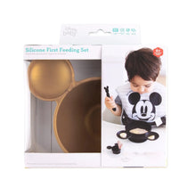 Load image into Gallery viewer, Bumkins Silicone First Feeding Set: Minnie Mouse Gold is shown in a packaging box, with a clear window partially showing the bowl.