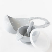 Load image into Gallery viewer, Bumkins Silicone First Feeding Set: Gray sits in front of a gray silicone bib on a white background.
